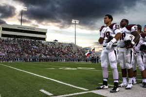 Pearland defensive back Matt La Chiusa and his teammates stand during the playing of the National Anthem before the Oilers' opening game of the 2014 Texas high school football season against the Conroe Woodlands College Park Cavaliers played on August 29, 2014 at Woodforest Bank Stadium in Shenandoah, Texas. Pearland would go on to win the contest 25-14.