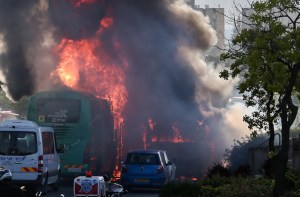 Firefighters and rescue personnel at the scene of a possible bus bombing, in jerusalem, on April 18, 2016, leaving at least 15 people injured. Police are investigating if the incident was a terror attack. The explosion occured on bus 12, while passing by the neighborhood of Talpiot, the bus was empty at the time, the injuries were from people on an adjacent bus. Photo by Nati Shohat/FLASh90